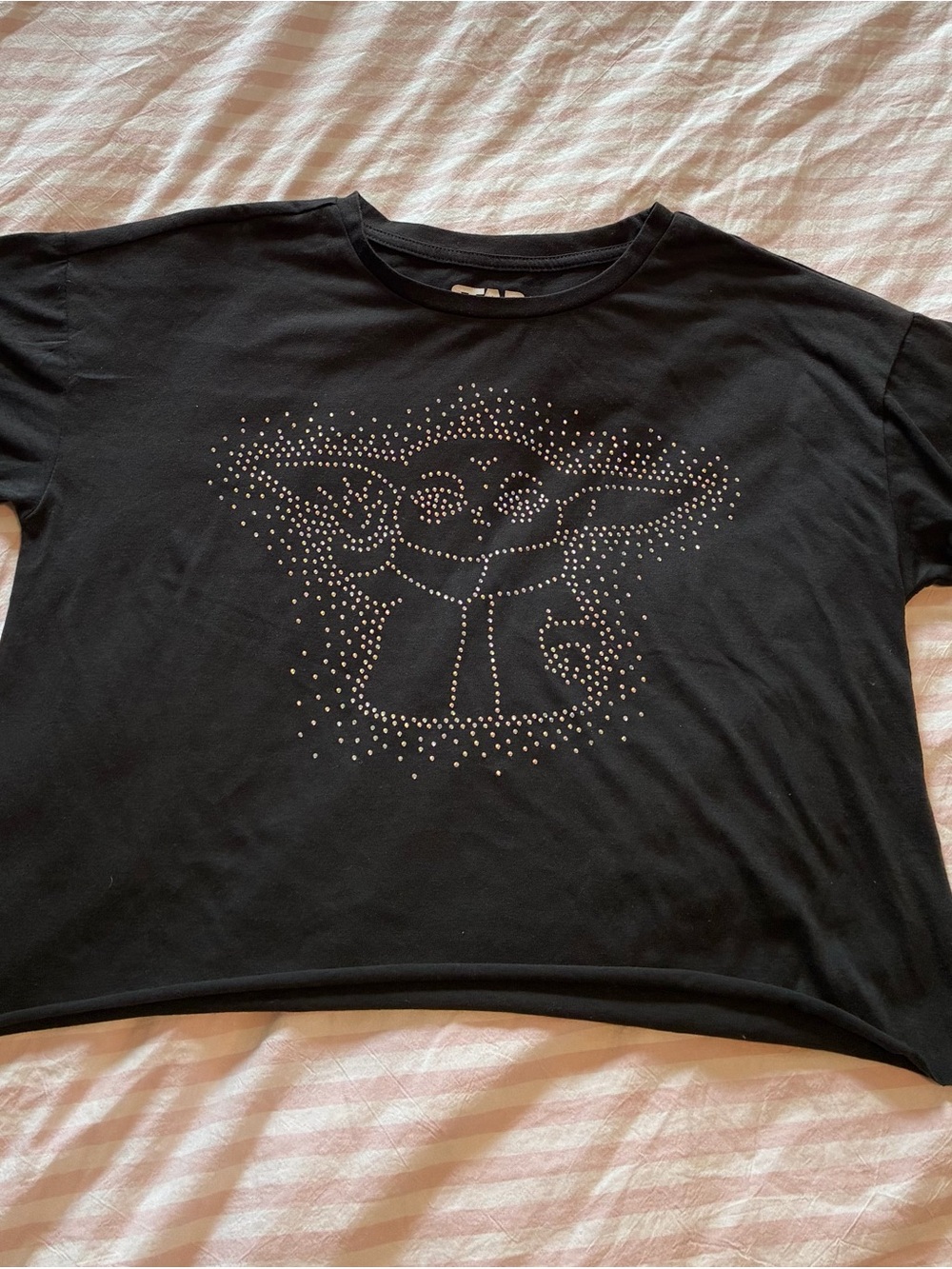 Womenโs Black Graphic Tee with Rhinestone Baby Yoda Design